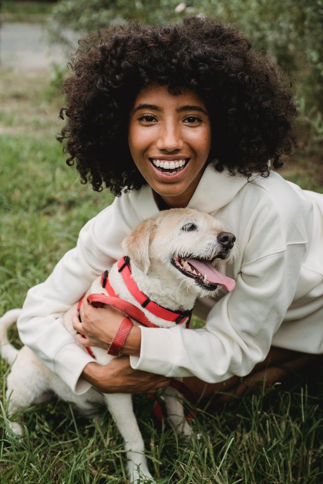 "A person finds comfort and emotional support in hugging their loyal emotional support dog, highlighting the strong bond and the role of pets in offering companionship and emotional stability."